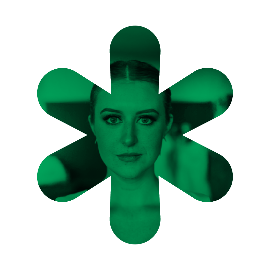 Woman’s face in green asterisk.